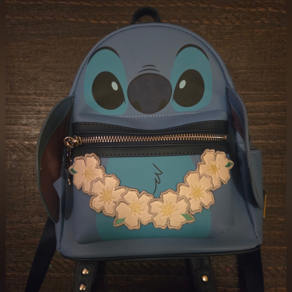 Blue Character Backpack with Floral Embellishments